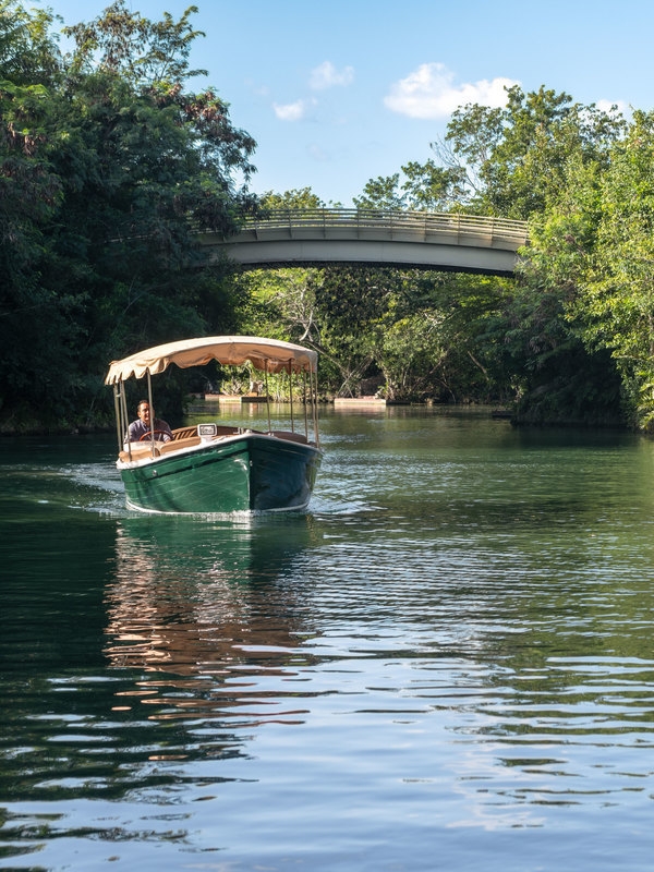 A speedboat cruising the waterways at Rosewood Mayakoba.