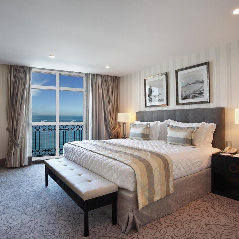 A bedroom suite with ocean views at Hotel Miramar by Windsor