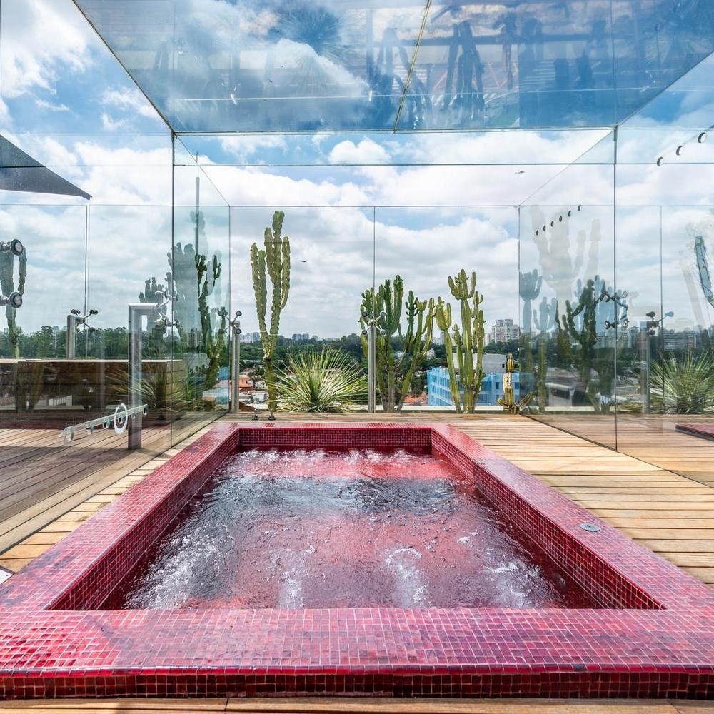Rooftop pool with red tiles at Hotel Unique