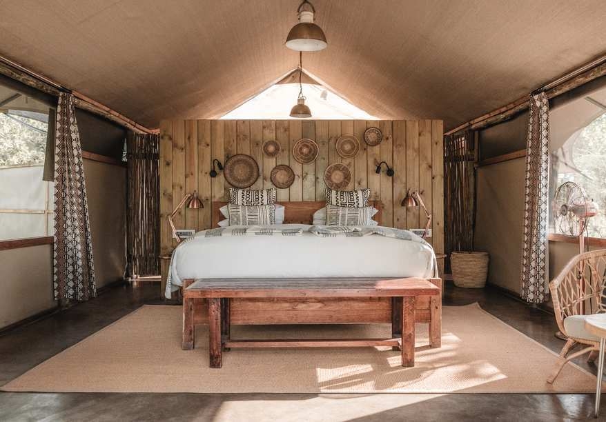 The bedroom of a tent at Wilderness Little Makalolo.