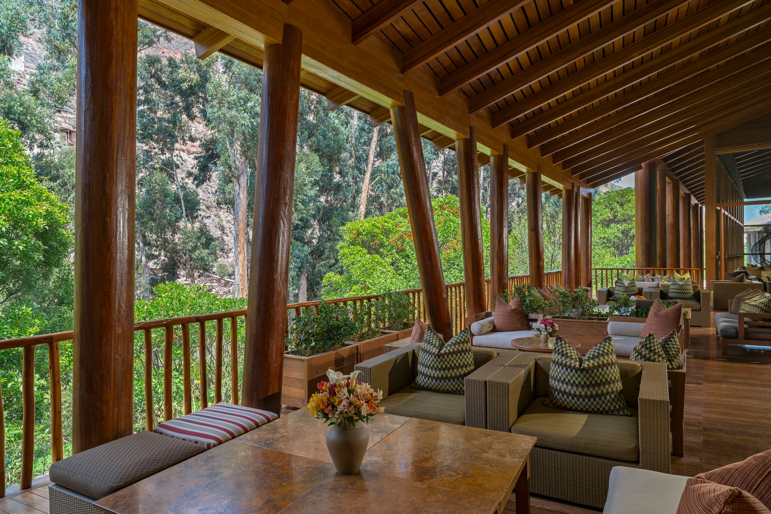 Covered outdoor terrace looking out onto the trees at Tambo del Inka, Peru