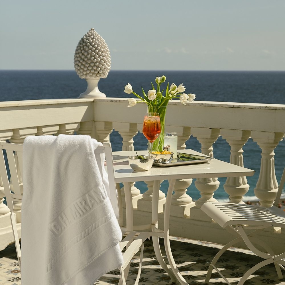 A table on a terrace at Grand Hotel Miramare