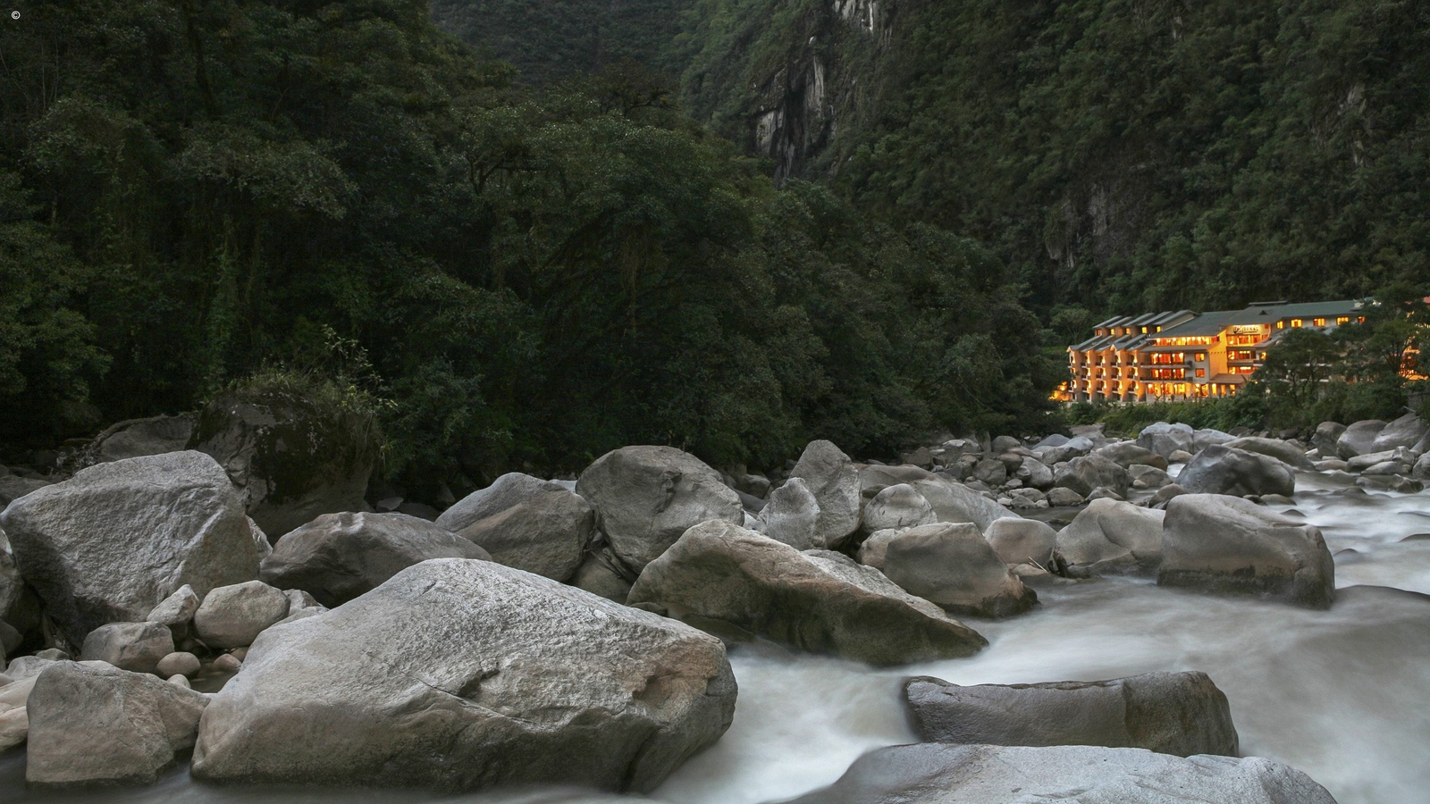 Flowing water of the river near Sumaq taken on a slow shutter speed capturing a ghostly air to the water, Machu Picchu, Peru