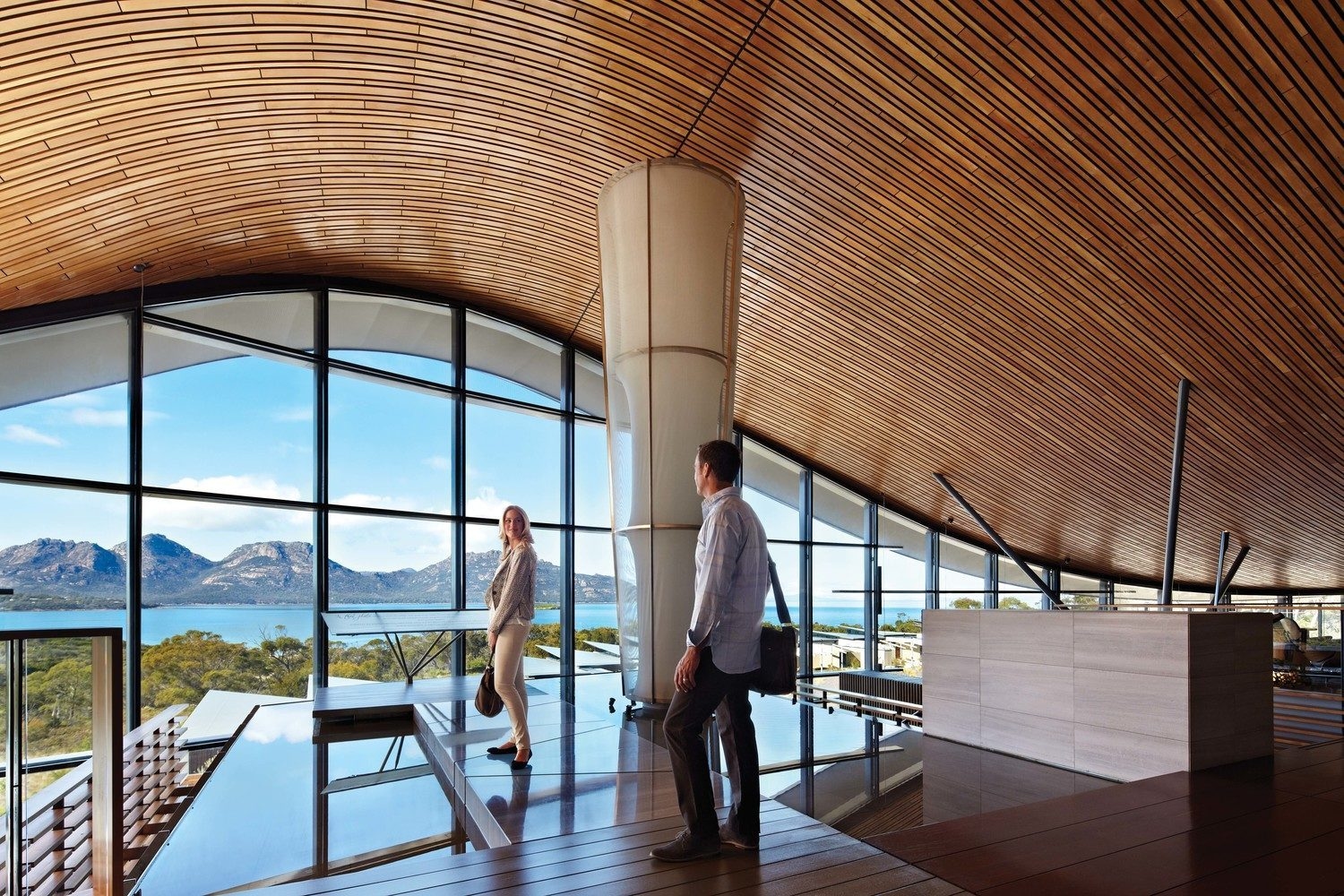 A couple standing in the lobby of Saffire Freycinet