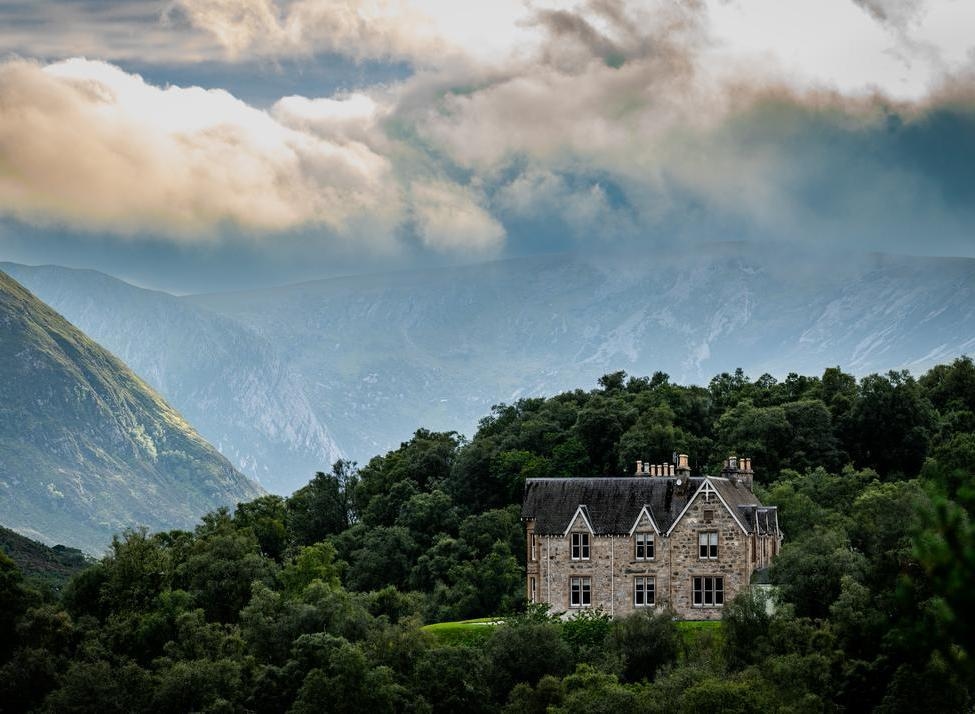 View of Alladale Wilderness Reserve in Scotland surrounded by forest and mountains