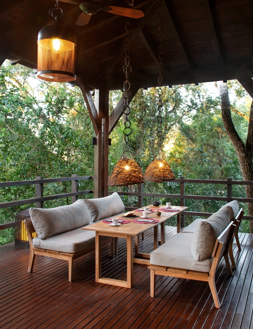 The airy dining area at Awasi Iguazu overlooking the forest.