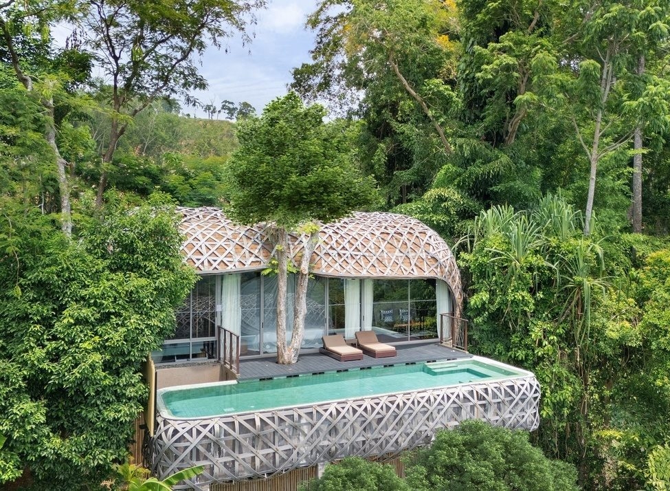 The woven-like exterior of Keemala's bird's nest villa tucked between the trees.