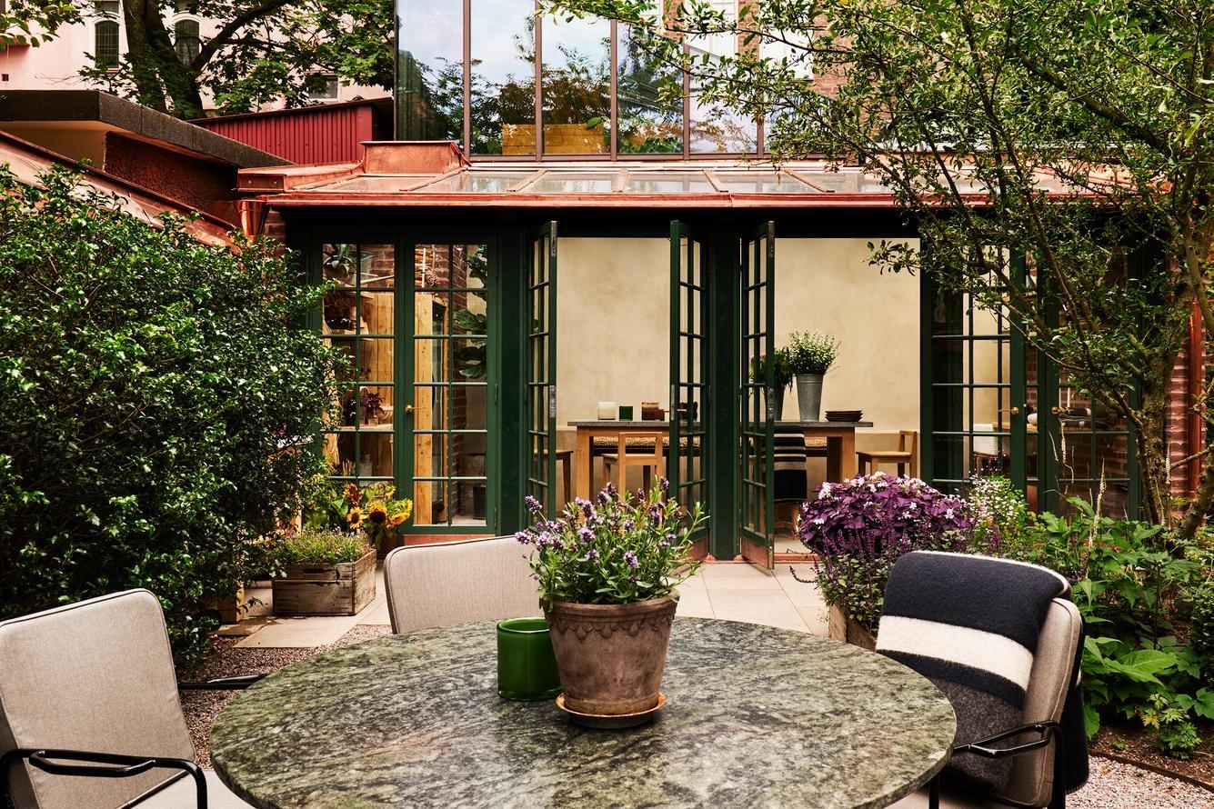 The outdoor dining area at Ett Hem, located in the garden.