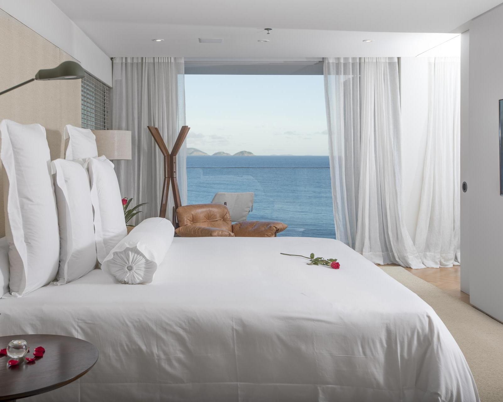 A bedroom with ocean views at Emiliano Rio de Janeiro