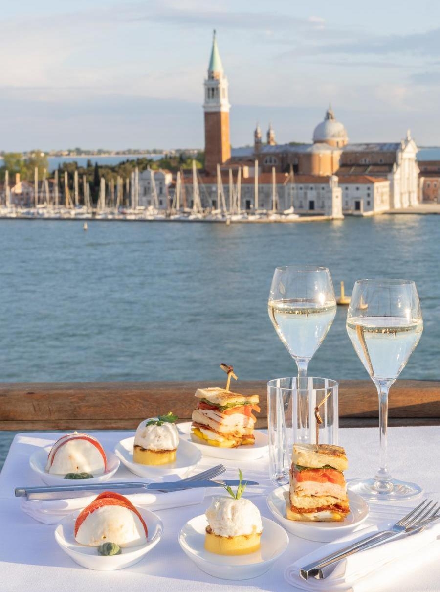 Food and wine on the terrace at Hotel Londra Palace in Venice.