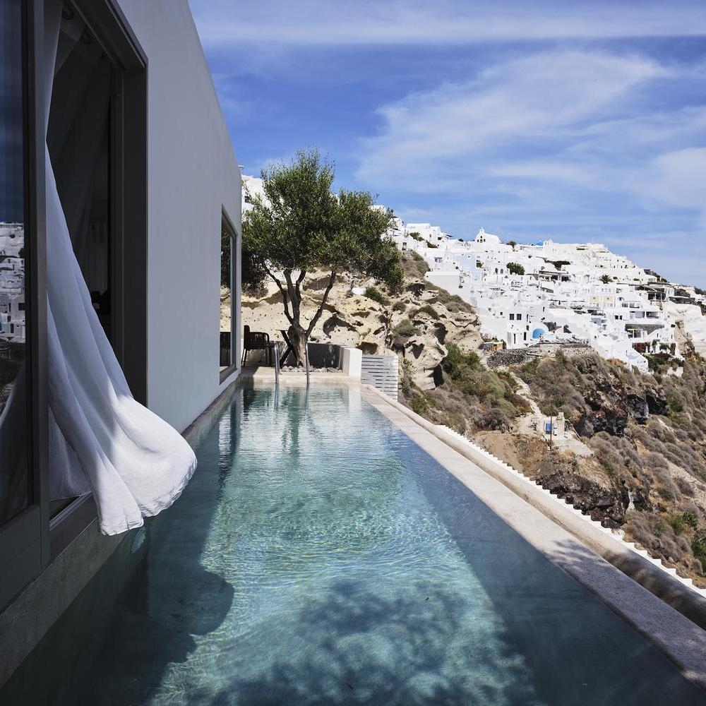 Infinity pool with clifftop views at Andronis Luxury Suites
