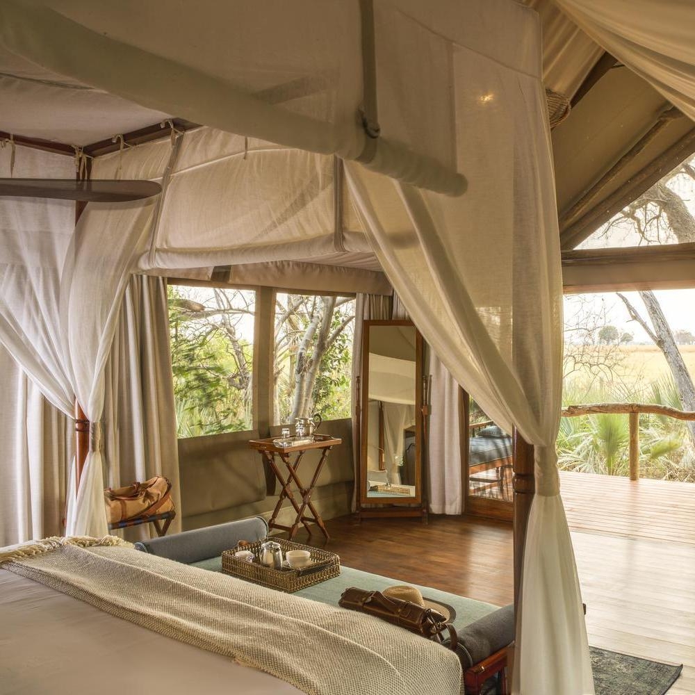 A bedroom of Shinde Camp's tents perched between tree canopies. It overlooks the delta ahead.