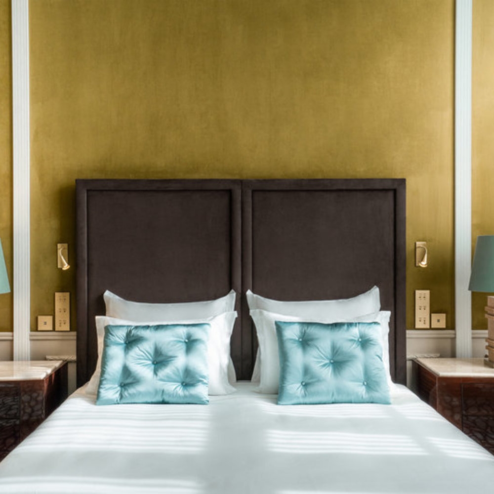 The bedframe in a Superior room at Le Monumental Palace
