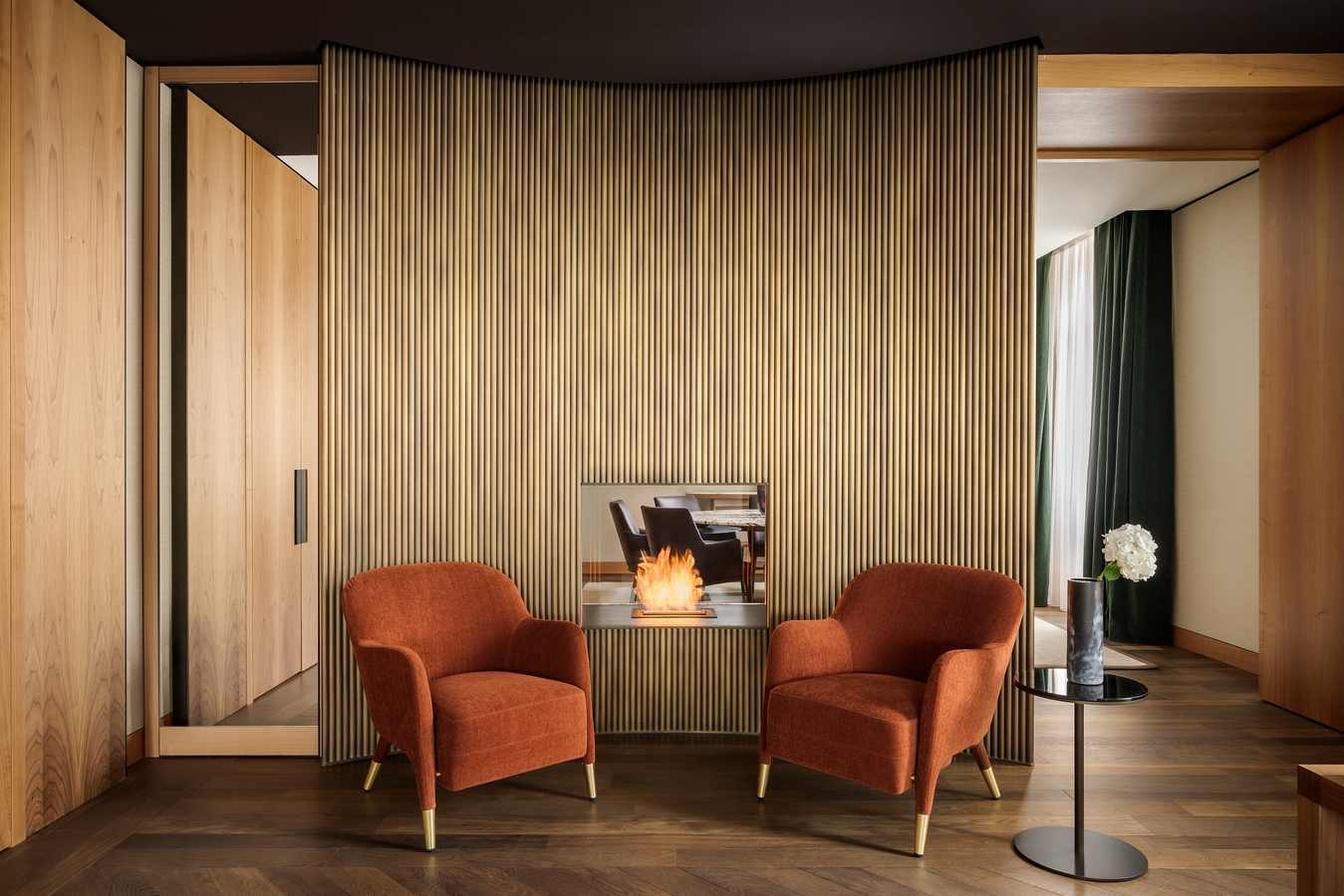 A sleek lounge area of Park Hyatt Milan, featuring two arm chairs.