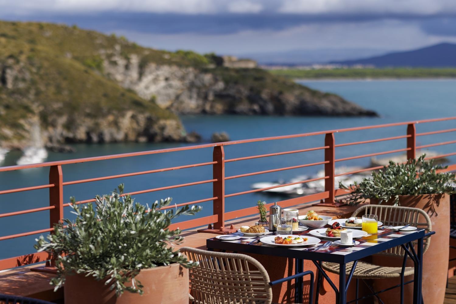 La Roqqa's restaurant, featuring a panoramic terrace area overlooking the sea.