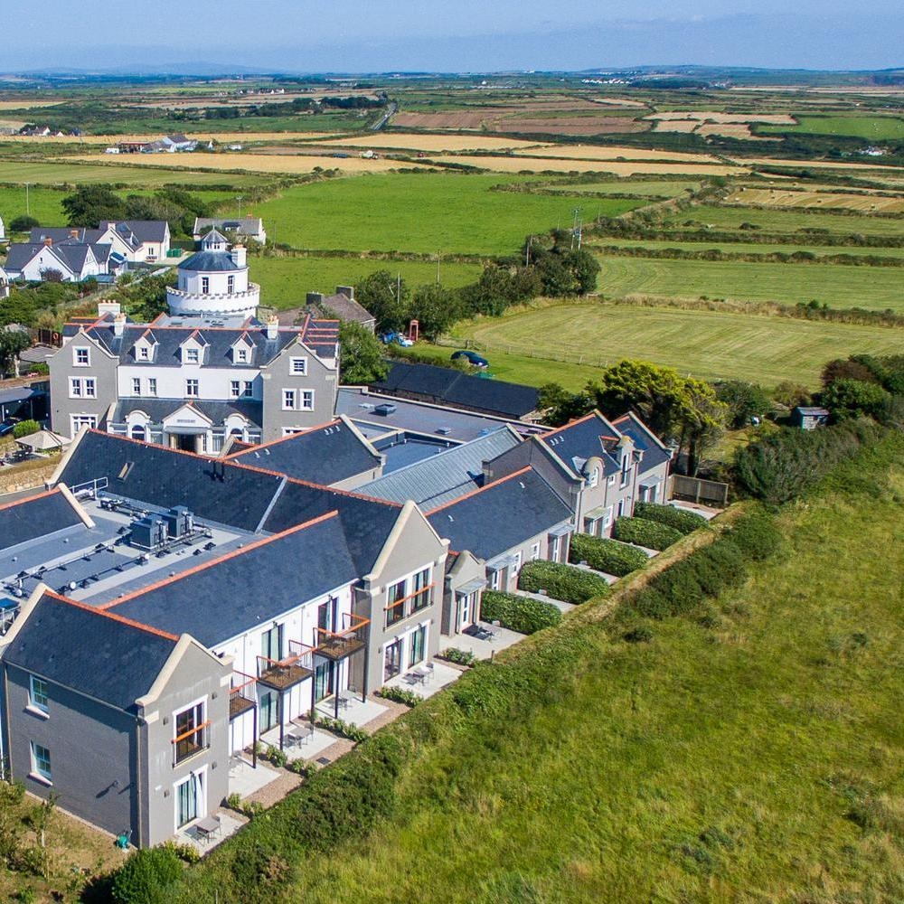 Aerial view of Twr Y Felin hotel surrounded by fields