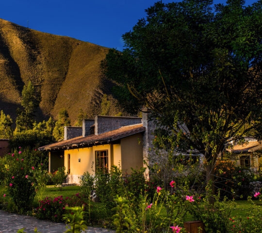 Lush gardens of Sol y Luna Lodge and Spa at golden hour, Sacred Valley, Peru