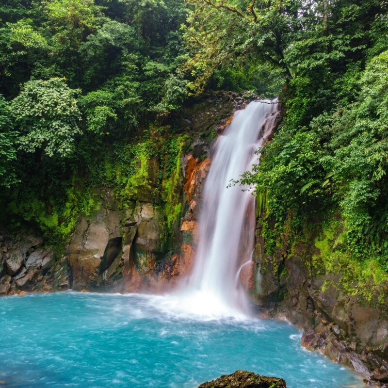 Luxury Costa Rica tours - Celestial blue waterfall and pond in tenorio national park, Costa Rica