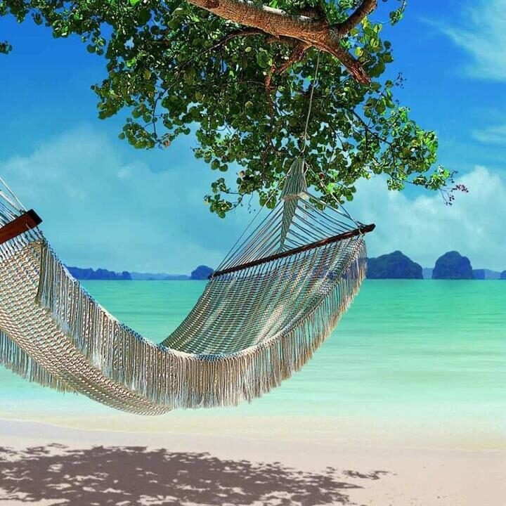 Luxury Thailand Tours - hammock on the beach with clear blue water in the background
