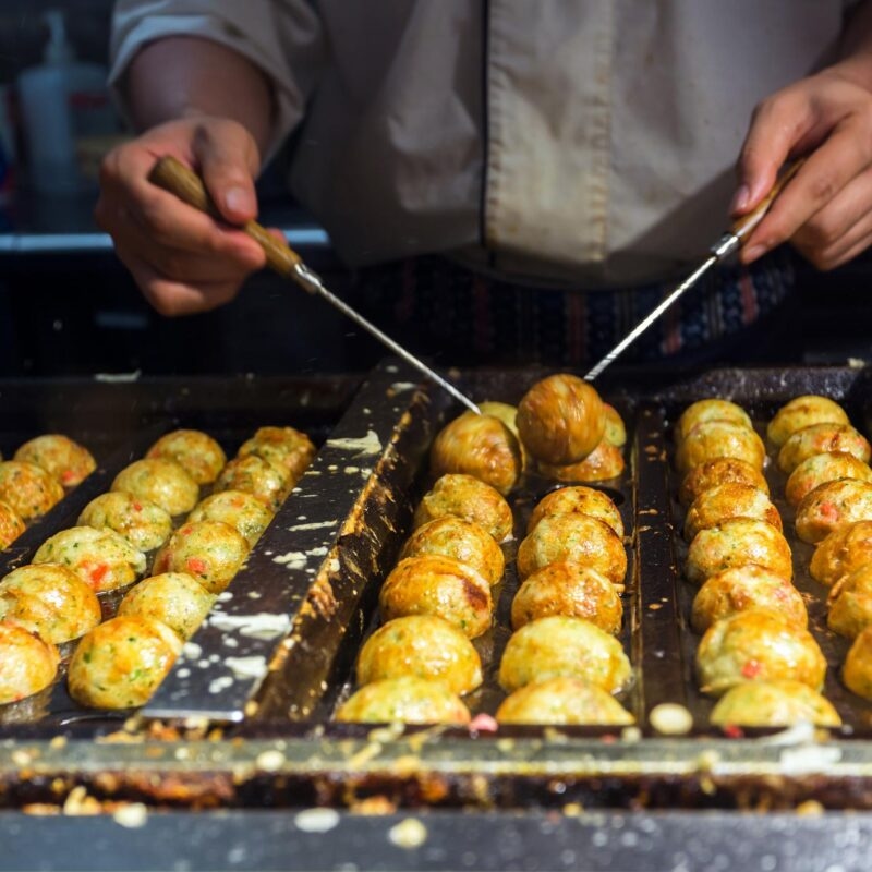 Private Japan Luxury Tours - japanese chef cooking takoyaki, tagoyaki is delicious snack in japan.