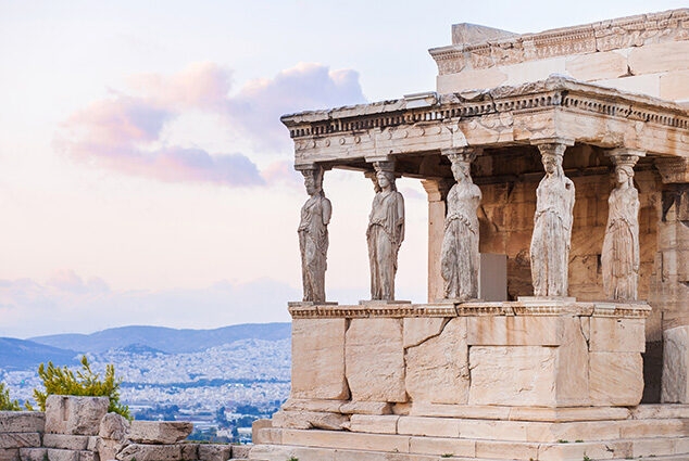 Ancient Greek Caryatid statues on the Acropolis for luxury history tours.