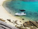 A small boat on the white sand at Lizard Island, Australia