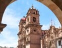 A church in the city of Cusco, Peru, seen through an archway
