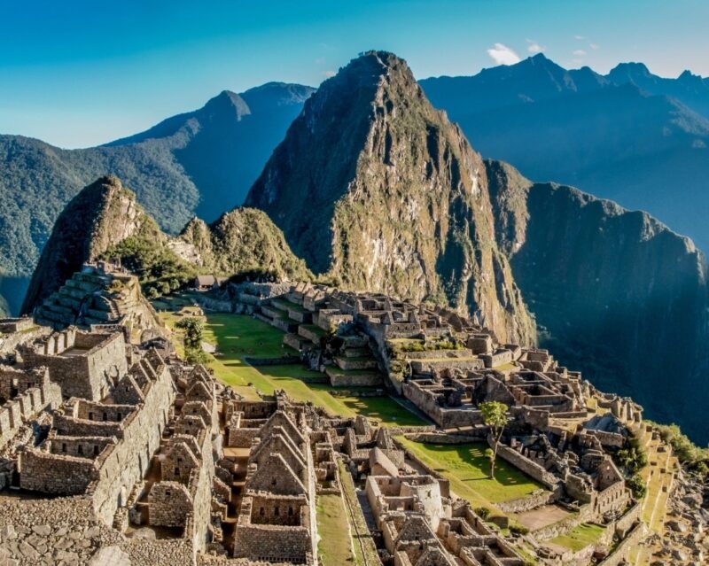 Wide view of the stone buildings and terraces of Machu Picchu during luxury Inca Trail trips.