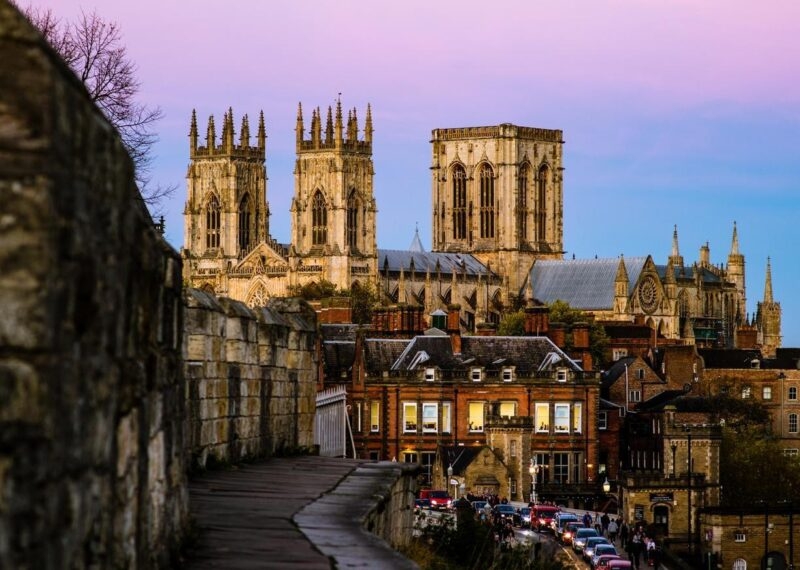 The York Minster and city walls at sunset