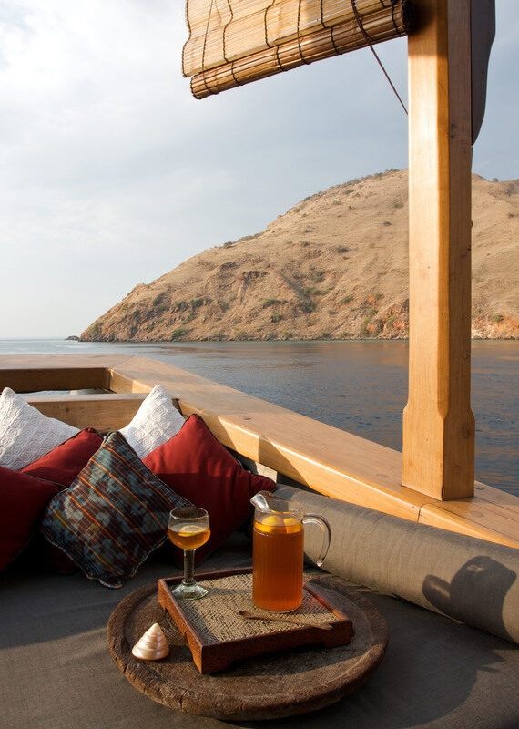Drinks on the deck of the Silolona yacht charter in Indonesia