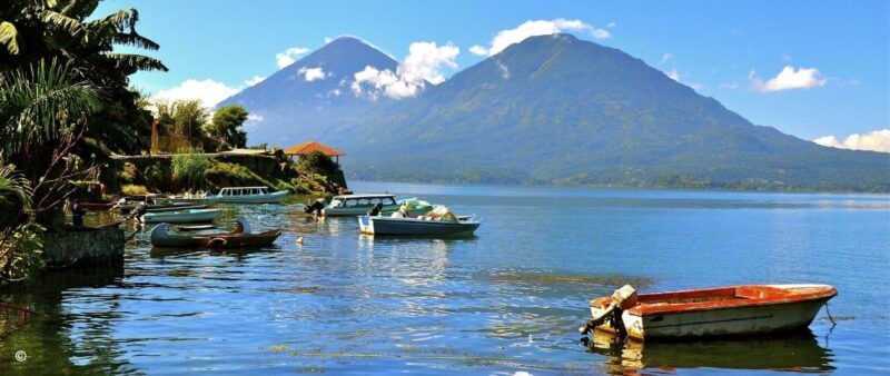 Boats moored on Lake Atitlan in Guatemala against a mountainous backdrop