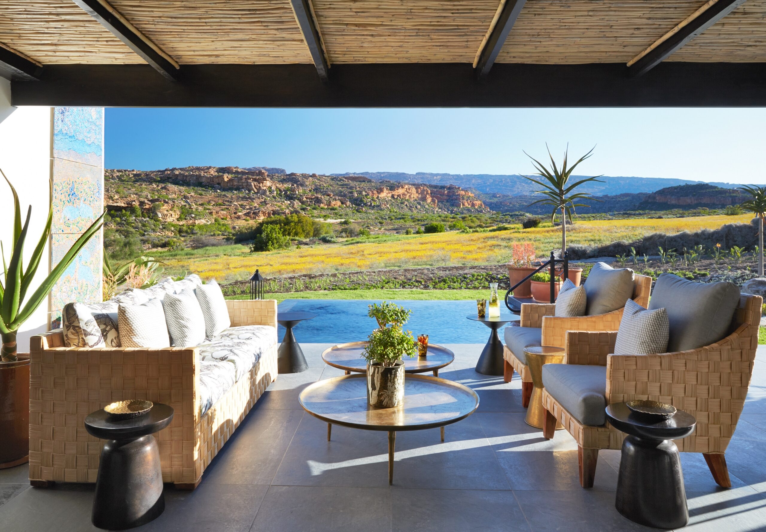 Luxury outdoor lounge area with scenic mountain view.