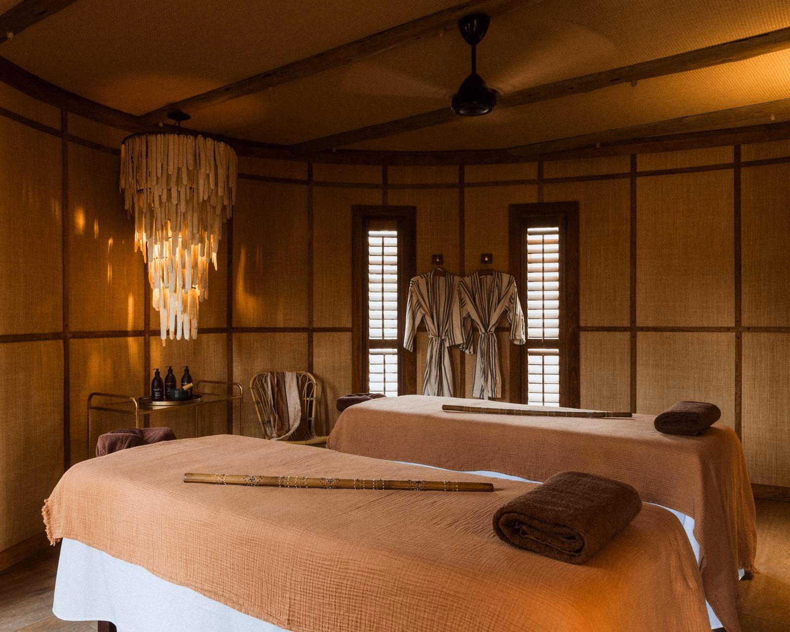 Room with two massage tables for treatment at The Sanctuary spa at Wilderness Mombo