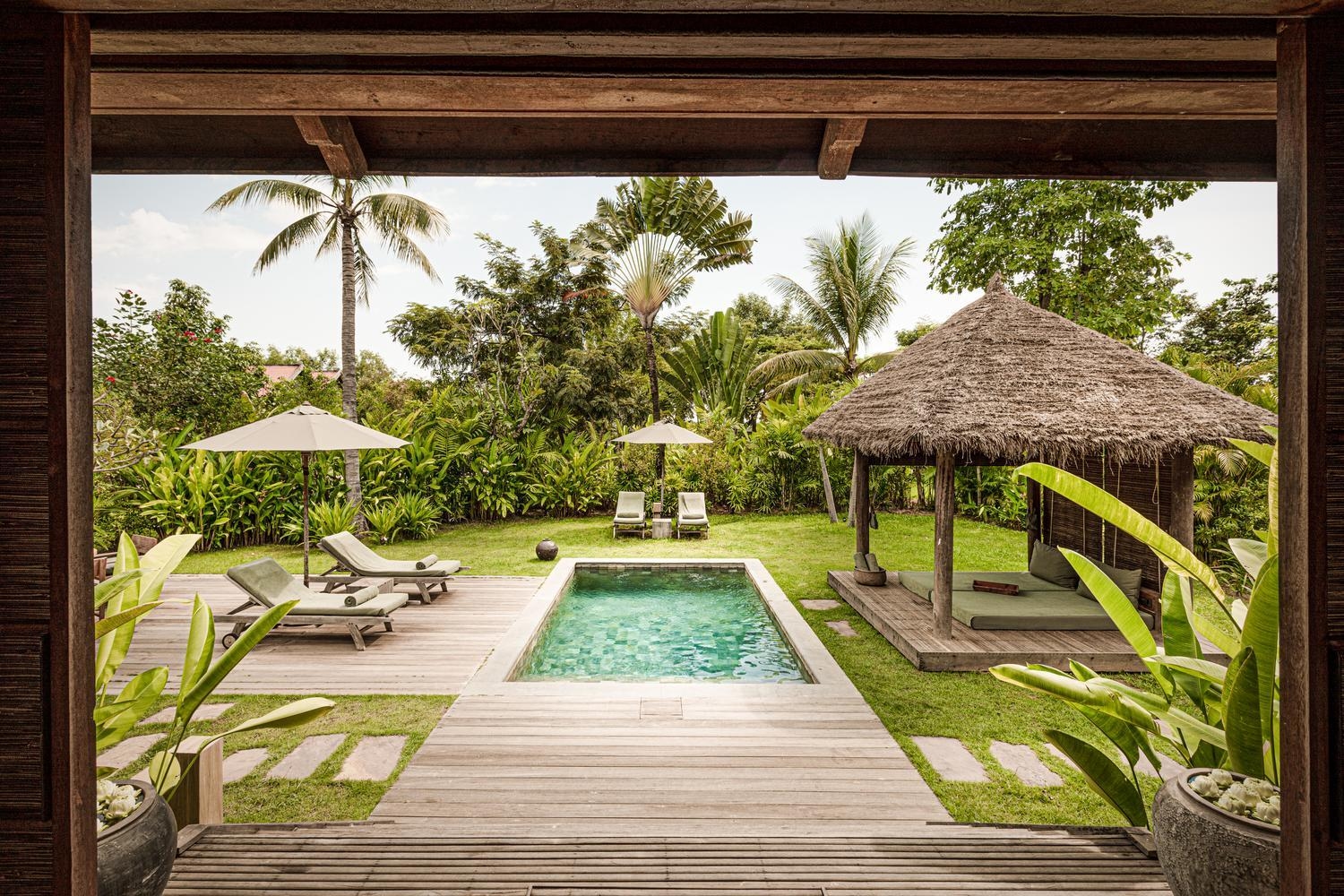 Outdoor pool and garden at Zannier Phum Baitang