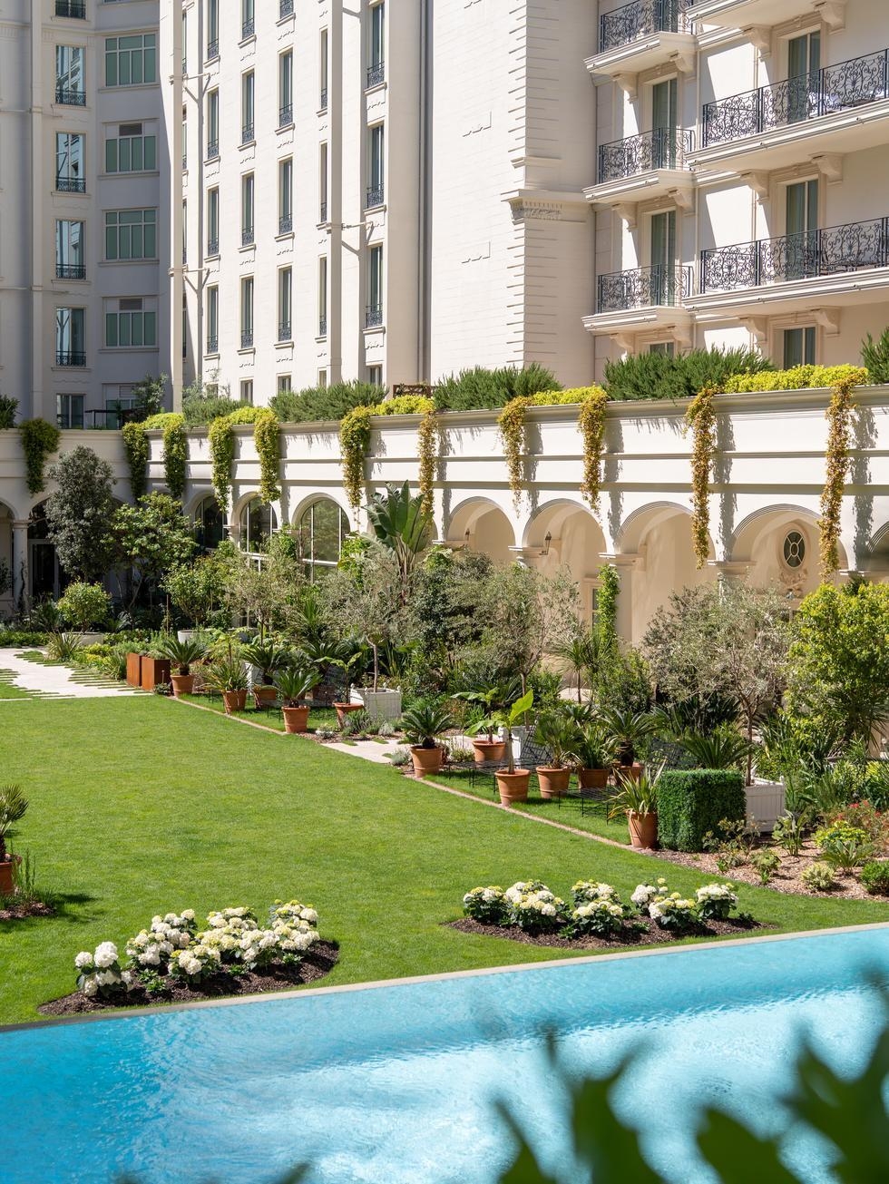 A view of the pool area in the inner courtyard at Carlton Cannes.
