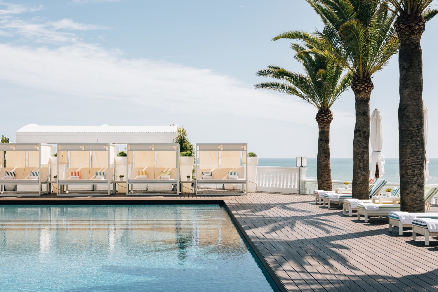 View of the pool with sun loungers at Hotel Bela Vista