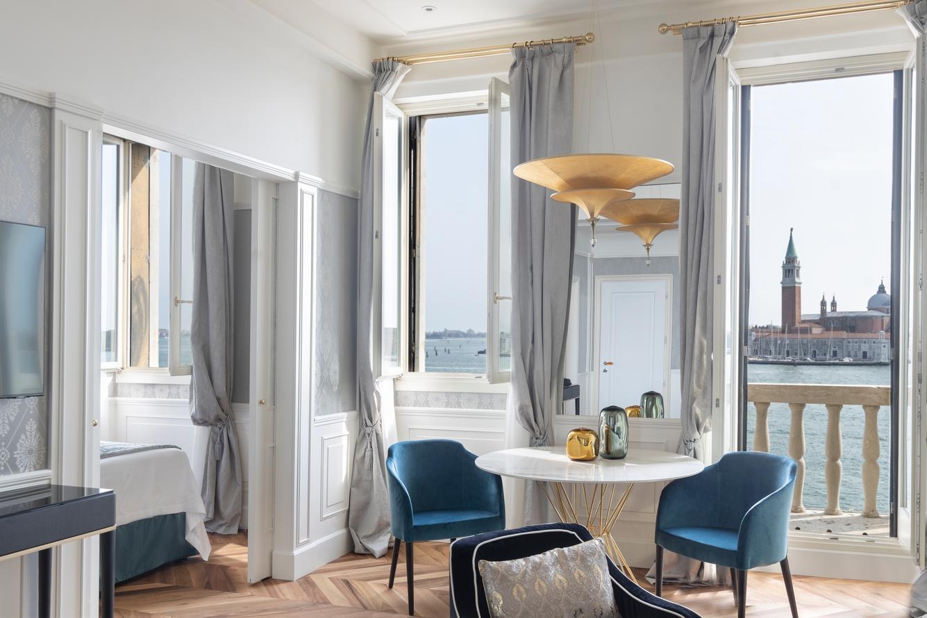 The lagoon-facing lounge area of a suite at Hotel Londra Palace in Venice.