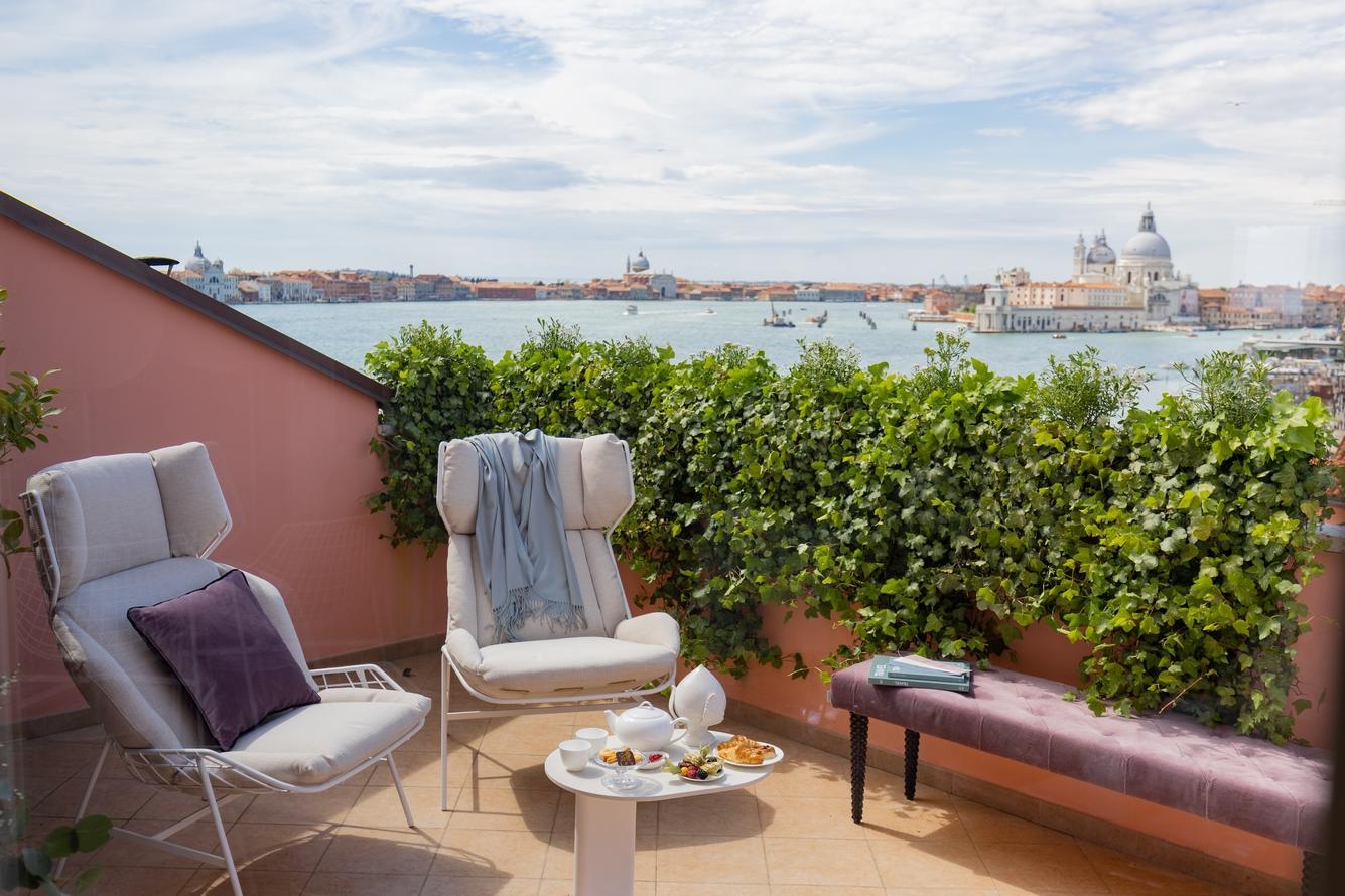The private balcony of a panoramic view room at Hotel Londra Palace in Venice overlooking the lagoon.