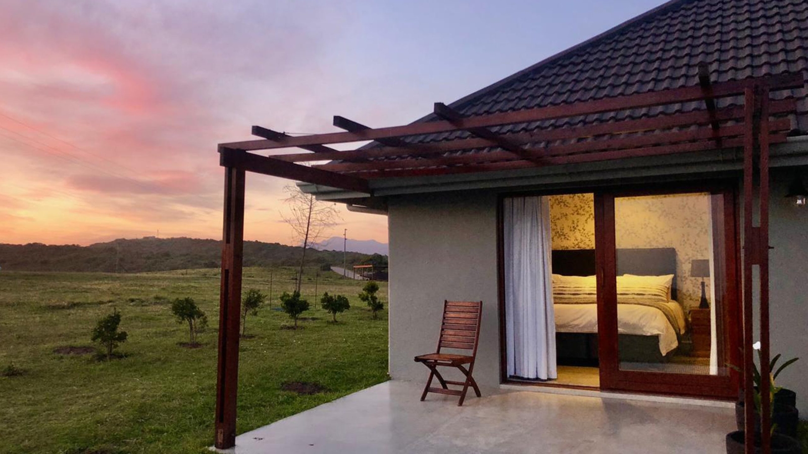 An utdoor terrace at Simbavati Fynbos on Sea at sunset