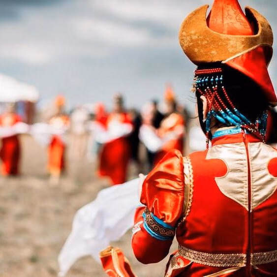 Photo of young beautiful women wearing in traditional national mongolian kalmykian dresses in the festival Photo of young beautiful women wearing in traditional national mongolian kalmykian dresses in the festival. yurt, nomad, mongolian, woman, culture, accessories, asia, beads, century, city, clothing, colorful, copy, costume, dance, decoration, detailed, dress, empire, ethnic, fashion, female, festival, folklore, genghis, girl, hat, khan, kalmykia, mongol, mongolia, national, native, outfit, people, space, style, symbol, symbolic, temple, traditional, unique, white, young, red, clouds, field, spring, early Mongolia