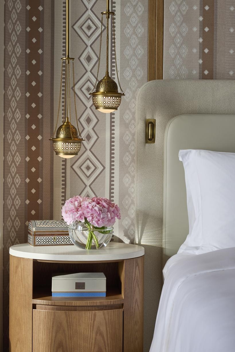 Bedroom details of Mandarin Oriental Muscat. This is a glimpse of bedside lamps inspired by frankincense burners.