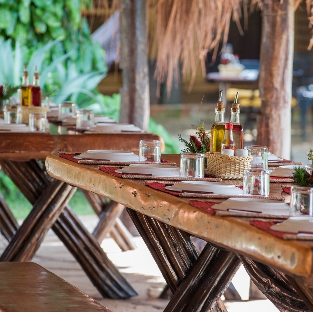 Outdoor dining tables at Araras EcoLodge in Brazil