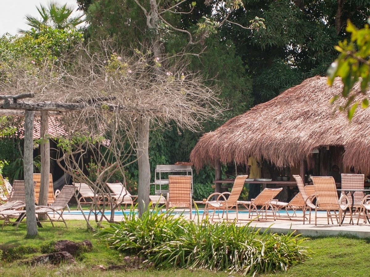 Sunloungers around the outdoor pool at Araras EcoLodge in Brazil