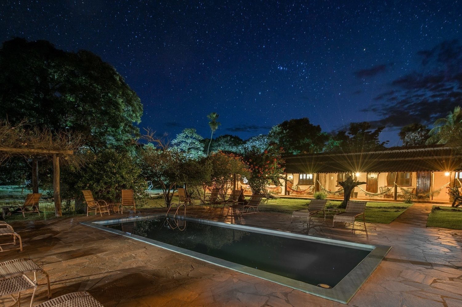 The outdoor pool at night at Araras EcoLodge in Brazil