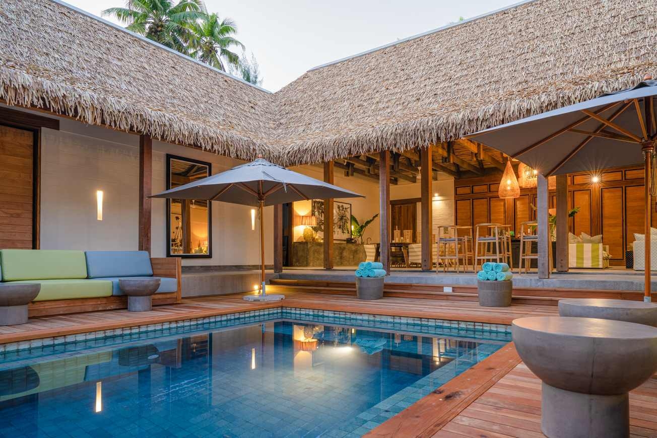 The outdoor area of a beach retreat on Alphonse Island, featuring a private outdoor pool.