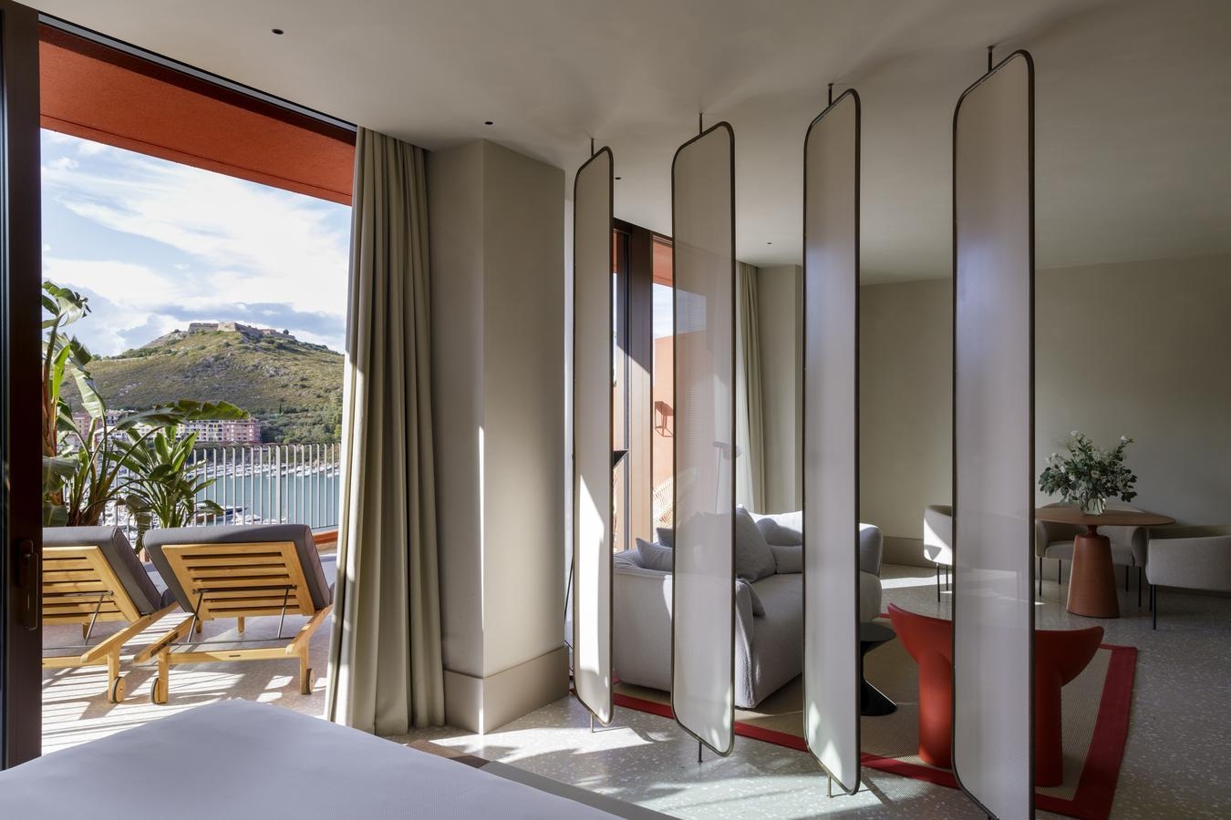 A sea-view suite at La Roqqa overlooking the harbour of Porto Ercole.