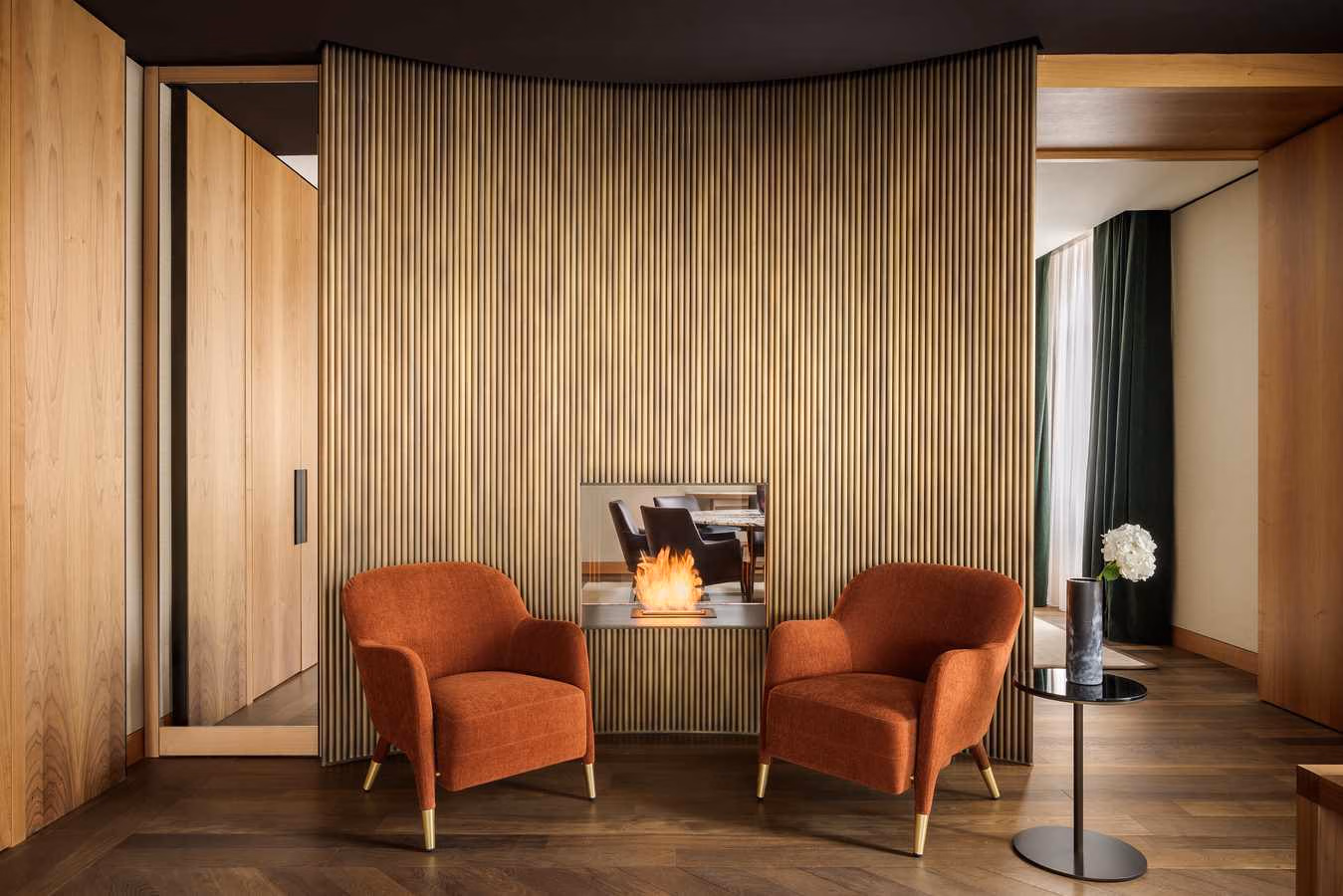 A sleek lounge area of Park Hyatt Milan, featuring two arm chairs.