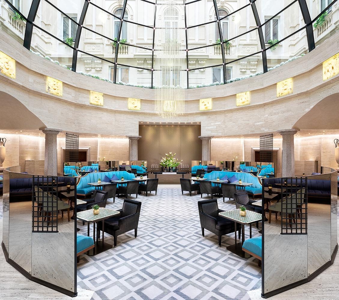 Lounge area of Park Hyatt Milan, featuring a glass domed ceiling.