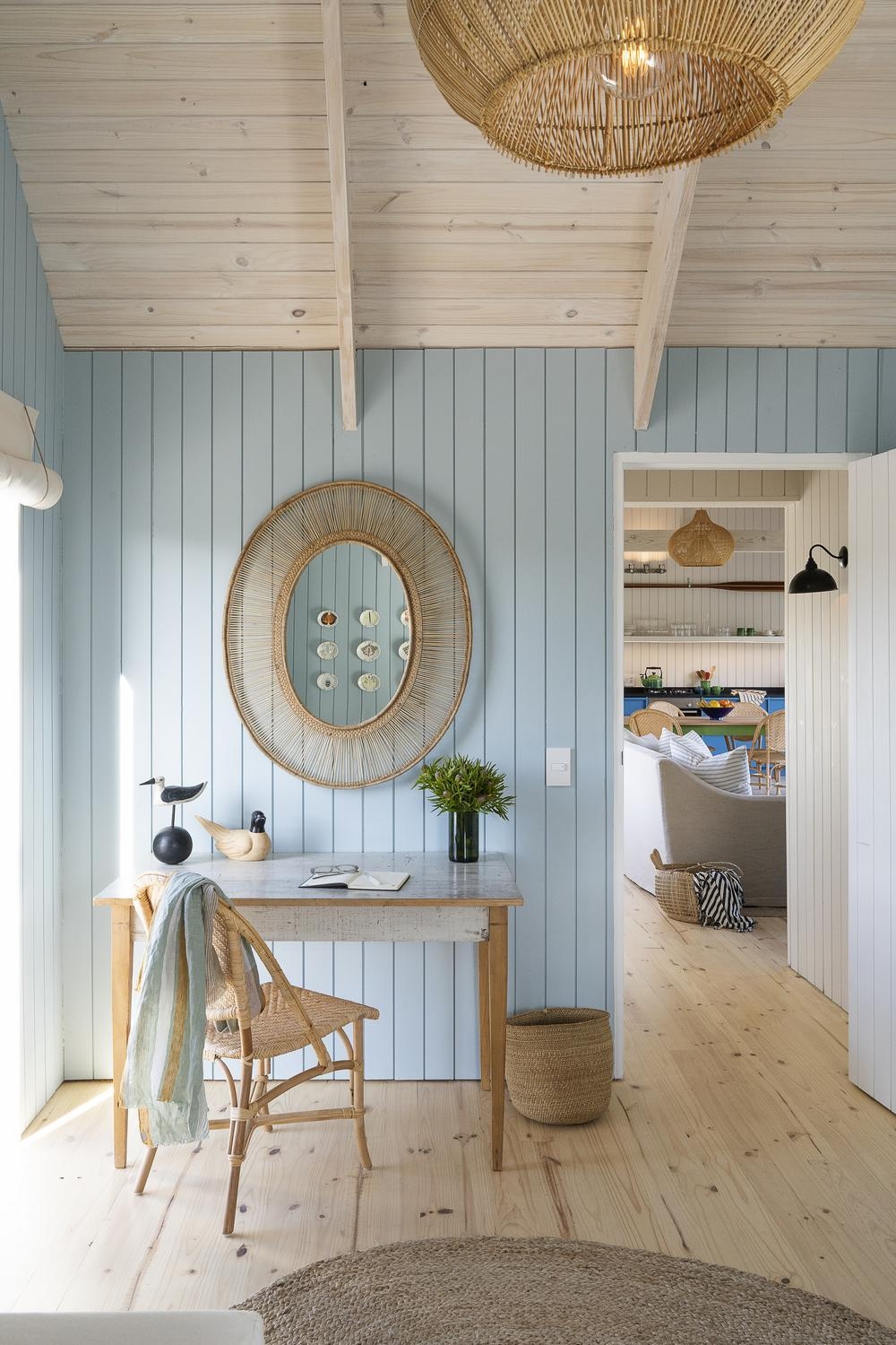 A pastel hued interior of a private boathouse at Coot Club.