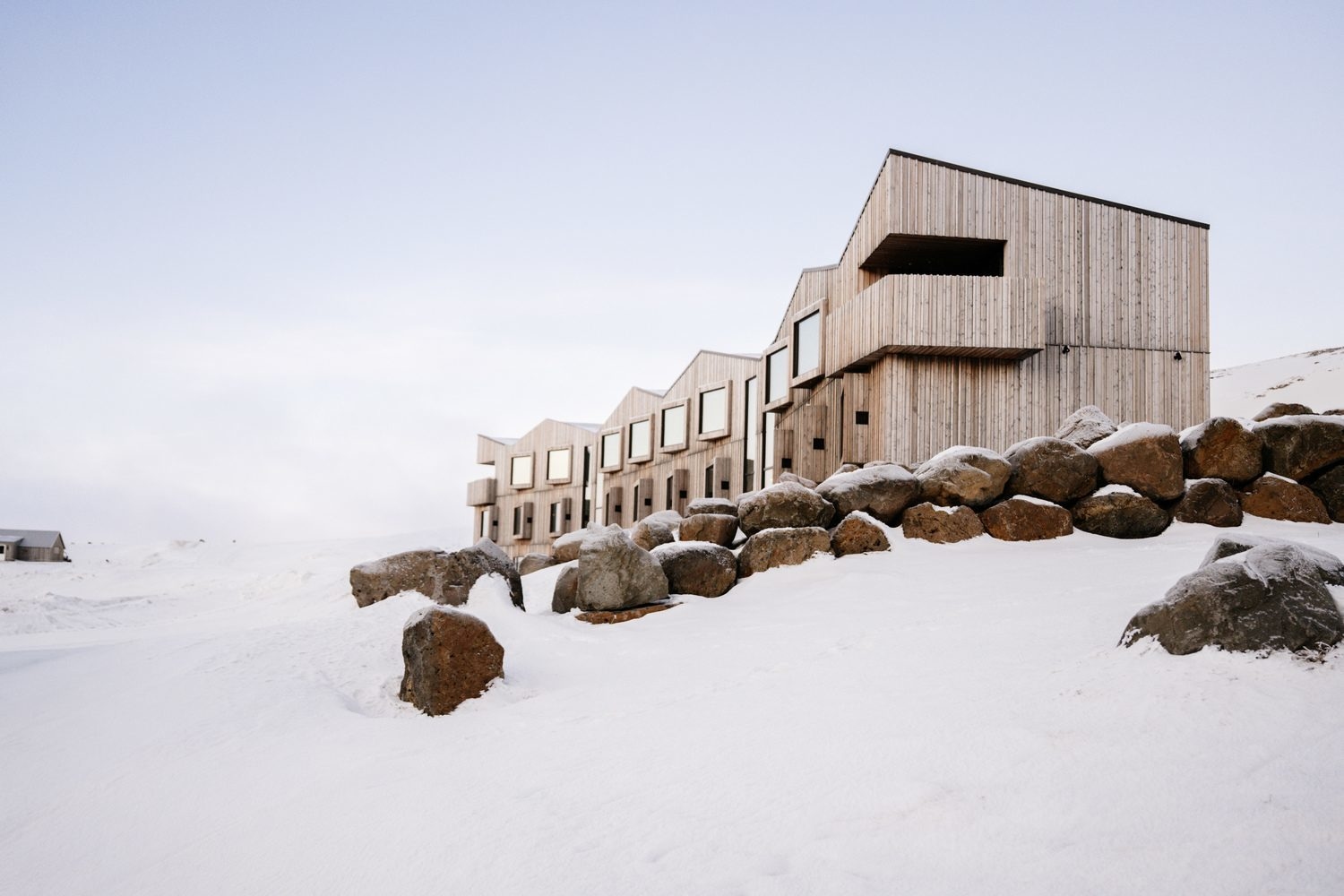 The exterior of Highland base hotel in Iceland surrounded by snow